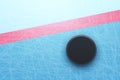 hockey puck behind red line top view Royalty Free Stock Photo