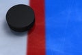 Hockey puck crossed a red line Royalty Free Stock Photo