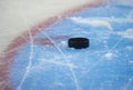 Hockey puck and stick on the ice arena Royalty Free Stock Photo