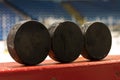 Hockey Pucks on Bench Royalty Free Stock Photo