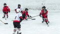 Hockey season, kids play national game at a winter carnival.
