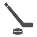 Hockey solid icon. Hockey stick and washer symbol illustration isolated on white. Sport ice hockey stick And Puck glyph