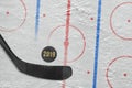 Hockey stick, puck and a fragment of hockey arena with markup