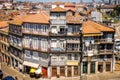 Colorful buildings on a curved street in Portos Portugal as viewed from above