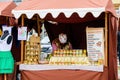 Detail of a stall with mustard at a farmers market with a lady seller in South Moravia