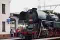 Historic steam locomotive at train station