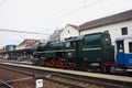 Historic steam locomotive at train station