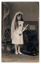 Vintage photo of a young girl - her first holy communion, circa 1930