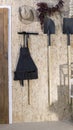 hoe, shovel, harrow and hat beside wooden door Royalty Free Stock Photo