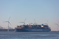 Large cargo cosco shipping container vessel sailing past Hoek van Holland and Maasvlakte harbour towards port Rotterdam