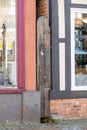 Narrow wooden door closes the space between two old houses in Germany