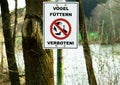 Notice sign `VÃÂ¶gel fÃÂ¼ttern verboten!` Translation: Do not feed the birds!