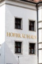 Hofbrauhaus sign on white walls of building