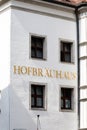 Hofbrauhaus sign on white walls of building