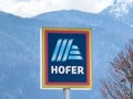 Hofer logo sign with mountain background in winter Royalty Free Stock Photo