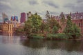 Hofvijver lake with the Binnenhof Gothic government buildings and skyscrapers in The Hague. Royalty Free Stock Photo