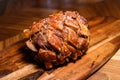 Hog roast pork isolated on wooden board at home kitchen table