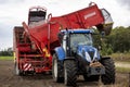 HOGE HEXEL, NETHERLANDS - Aug 30, 2020: Potato grubbing machine with tractor