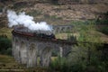 Hogwarts Express Jacobite steam train on Glenfinnan Viaduct in Scotland Royalty Free Stock Photo