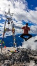 Hohe Warte - A man jumping from happiness on the Alpine peak