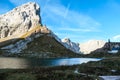 Hohe Warte - Reflection in a calm Alpine lake with a small cottage in the back Royalty Free Stock Photo