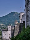 Hohensalzburg Fortress side walls view with owers and mountain, Salzburg, Austria