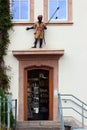 Hohenstein-Ernstthal, Germany - June 5, 2023: Decorative sculptures of black people and African warrior on facade of a pharmacy in