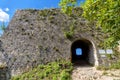 Hohenurach Castle in old town of Bad Urach, Germany. Overgrown stone wall and entrance of abandoned German castle Royalty Free Stock Photo