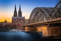 The Hohenzollern Bridge across the Rhine River with the Sunset View of the Cologne Cathedral UNESCO World Heritage Royalty Free Stock Photo