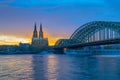 Hohenzollern Bridge with Cologne Cathedral at sunset in Cologne city, Germany Royalty Free Stock Photo