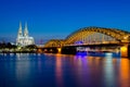 Hohenzollern bridge with t Cologne Cathedral and Rhine river during sunset in Cologne, Germany. Europe tourism, history building, Royalty Free Stock Photo