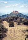 Hohenzollern Castle or Burg atop mount in summer, Germany. Famous old Gothic castle is landmark in Baden-Wurttemberg