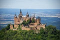 Hohenzollern Castle on mountain top. Germany. Famous landmark in vicinity of Stuttgart. Scenic view of Burg Hohenzollern