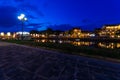 Hoi An city lights across the Thu Bon river in Vietnam