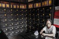 Old man eating peanuts in an old pharmacy, Hoi An, QuÃ¡ÂºÂ£ng Nam Province, Vietnam Royalty Free Stock Photo