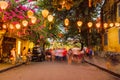 Hoi An Old Town motion blur of tourists walking in the colonial area at sunset.