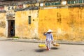 HOI AN, QUANG NAM, VIETNAM, April 26th, 2018:Vietnamese woman street seller In hoi an Vietnam in ancient town Hoi An with view of Royalty Free Stock Photo