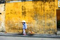 HOI AN, QUANG NAM, VIETNAM, April 26th, 2018:Vietnamese woman street seller In hoi an Vietnam in ancient town Hoi An with view of Royalty Free Stock Photo