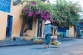 HOI AN, QUANG NAM, VIETNAM, SEPTEMBER 20, 2018: Vietnamese woman street seller In hoi an Vietnam in ancient town Hoi An Royalty Free Stock Photo