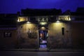 Exterior facade of an old heritage shop house in the town of Hoi An lit by lanterns at night Royalty Free Stock Photo