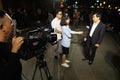 Mr. Nguyen Van Son, City People`s Committee Chairman interviewed by a television station on a street during Integration - Lighte