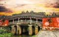 River with beautiful mystic japanese Chua Cau covered foot temple bridge in vietnamese town Royalty Free Stock Photo