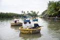 HOI AN,VIETNAM-December 9,2019: Tourists enjoy round basket boat Made of bamboo is a unique Vietnamese at Cam thanh village