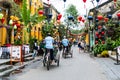 HOI AN, VIETNAM - January 10, 2023: Traveler sitting on traditional bicycle (cyclo) to visit the ancient city.