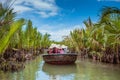 HOI AN, VIETNAM - MARCH 19, 2017: Tourists visit water coconut forest in Hoi An.