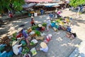 Hoi An, Vietnam - 13 May 2014: Flower vendors and food vendors selling products at Hoi An market