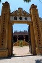 Vertical view. Main entrance gate to Van Thanh mieu Cam Pho temple in Hoi An, Vietnam