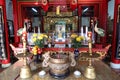 Detail of the censer and offerings in front of the altar of the Assembly Hall Of Fujian Chinese Temple in Hoi An