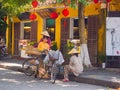 HOIAN, VIETNAM, SEPTEMBER, 04 2017: Unidentified people at street view with old houses, and colorful lanters made of