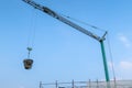 Hoist crane building construction houses roof transport construction material sky
